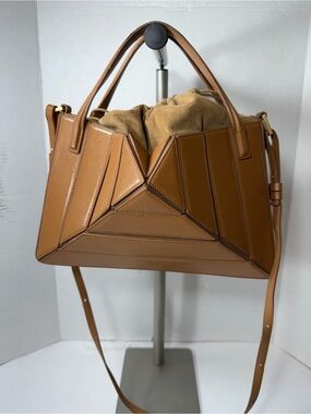Mlouye Sera Tote - Praline $710 is designed to complement any modern ensemble.